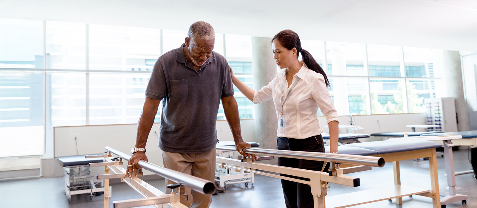 A physical therapist offering a physical therapy session to a patient