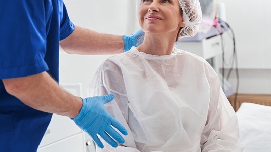 Nurse and patient on hospital bed