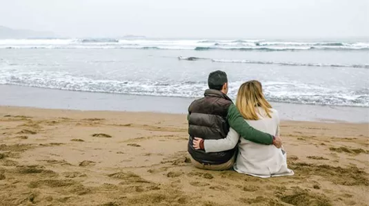 couple sitting on the beach