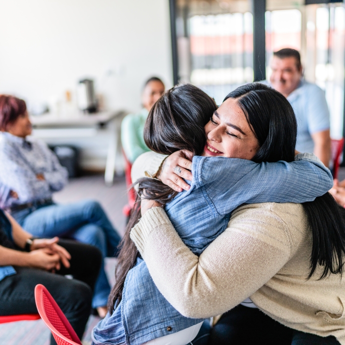 Two women hugging