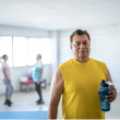 Man in yellow shirt working out