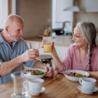 senior couple sharing breakfast meal